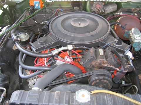 2001 Ford Crown Victoria - Photograph of a vintage Mopar engine in its bay, not a technical document.