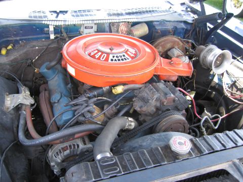 2001 Ford Crown Victoria - Photograph of a Mopar 440 four-barrel engine in its bay, not a technical document.