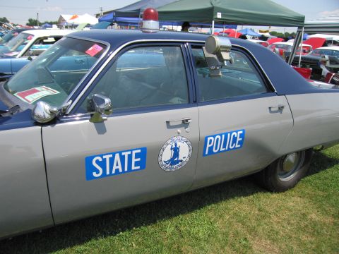 2001 Ford Crown Victoria - Photograph of a restored State Police sedan, not a technical document.
