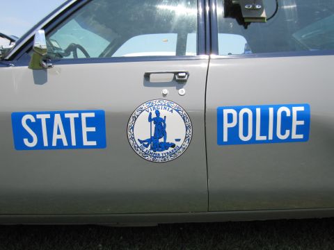 2001 Ford Crown Victoria - The door of a Virginia State Police vehicle is shown, official markings and the state seal.