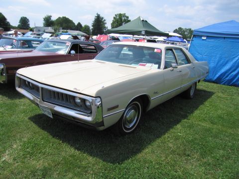 2001 Ford Crown Victoria - A 1971 Chrysler sedan is parked on a grassy field with tents and other vehicles nearby.