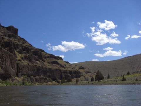 1993 Ford Bronco - A scenic view of a river bordered by hills on a clear day.