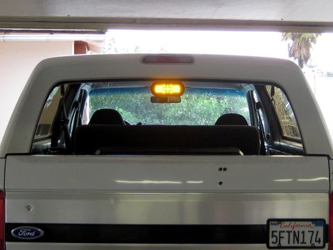 1996 Ford Bronco - Rear view of a 1996 Ford Bronco, an interior amber light bar and California license plates.