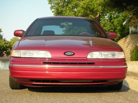 1992 Ford Crown Victoria - Front view of a red 1992 Ford Crown Victoria parked on a street.