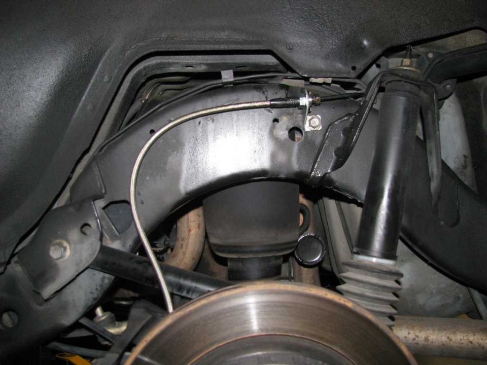 Stainless steel brake lines installed on the driver's side.