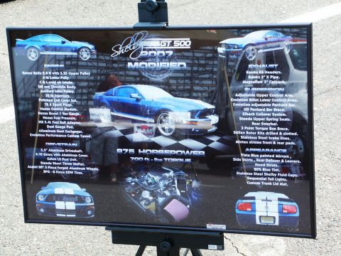 2001 Mercury Grand Marquis - Car-show spec display board for a blue modified 2007 Shelby GT500 listing engine, drivetrain, exhaust, suspension, and appearance modificat…