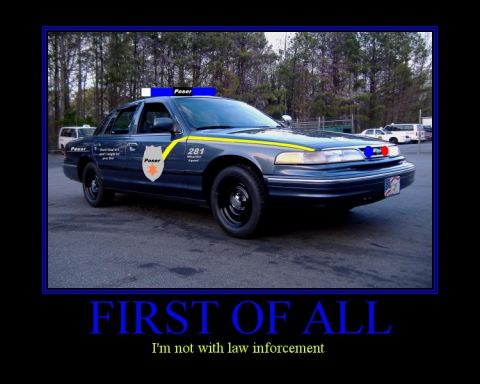 1996 Ford Crown Victoria - This modified 1996 Ford Crown Victoria has police-style lights and custom decals, but the text indicates it's not law enforcement.