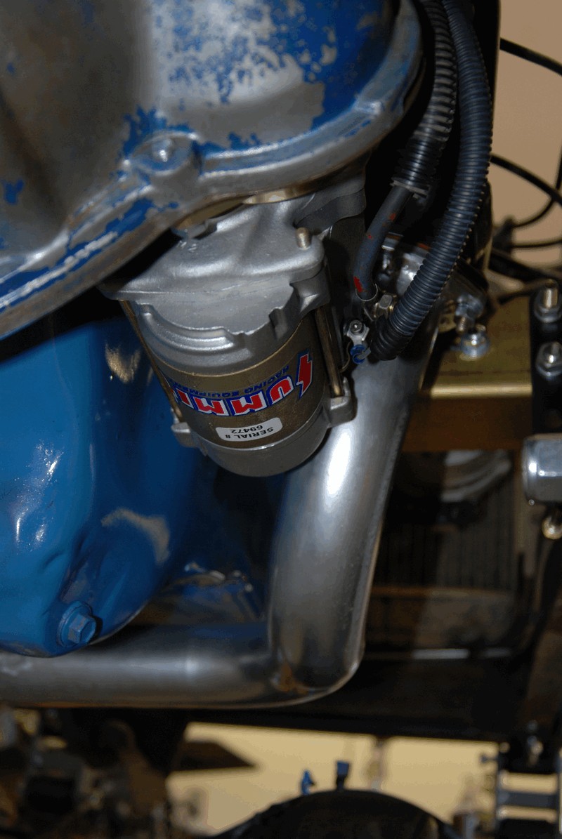 Silver starter motor with red and white Summit Racing logo