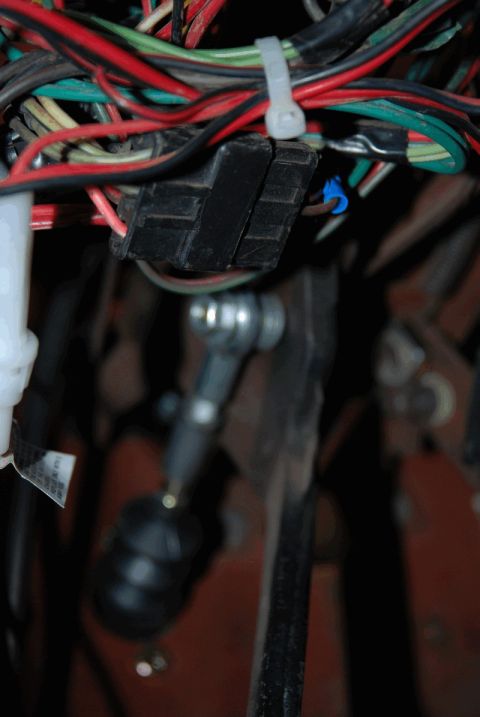 1975 Jeep CJ5 - Close-up view of a vehicle's interior wiring and mechanical linkage components.