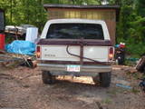 1979 Ford Bronco - Rear view of a 1978 Ford Bronco with a camper shell and spare tire carrier.