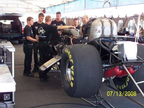 1972 Ford Ranchero - A team works on the engine of a drag racing car under a tent, with a date stamp of 07/13/2008.