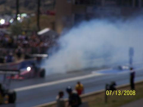 1972 Ford Ranchero - Drag racing event with a car producing smoke on the track.