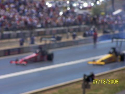 1972 Ford Ranchero - Two drag racing cars are on the track during an event, with spectators in the stands and a date stamp of 07/13/2008.