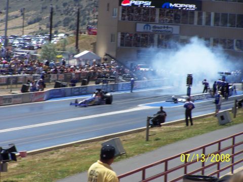 1972 Ford Ranchero - A drag race is underway with a dragster on the left producing smoke, as seen on 07/13/2008.