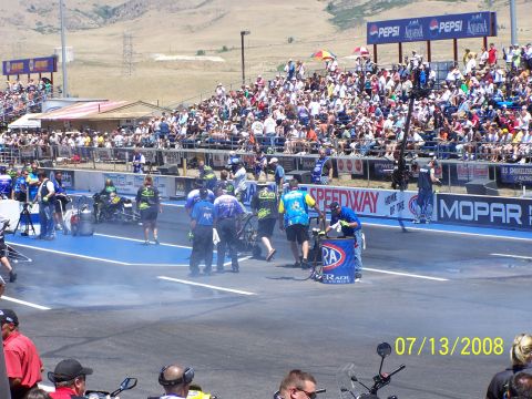 1972 Ford Ranchero - A drag racing event is underway with participants and spectators filling the stands.
