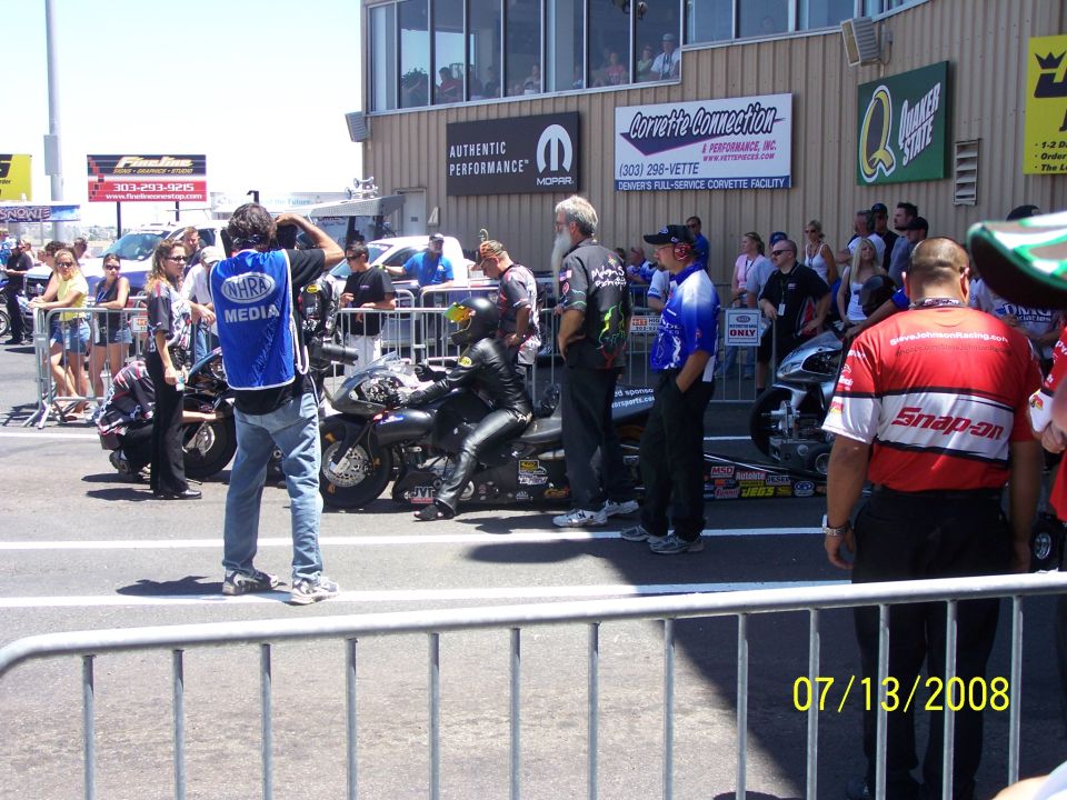 Drag racing motorcycles and crew at Bandimere Speedway