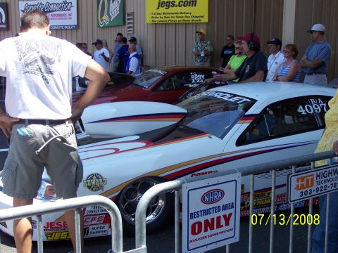 1972 Ford Ranchero - Two drag cars are lined up at Bandimere Speedway, with spectators watching. The date 07/13/2008 is visible on a sign.