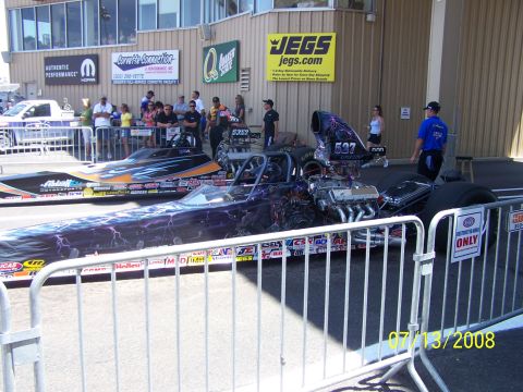 1972 Ford Ranchero - Two drag racing cars are parked at a track, with spectators and signage in the background. The date 07/13/2008 is visible.