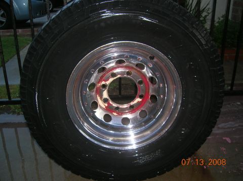 1985 Ford Bronco - Tire and rim assembly shown on a wet surface with a date stamp of 07.13.2008.