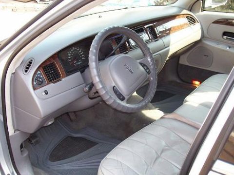 1998 Lincoln Town Car - Interior view of a 1998 Lincoln Town Car, showing the dashboard, steering wheel, and front seats.