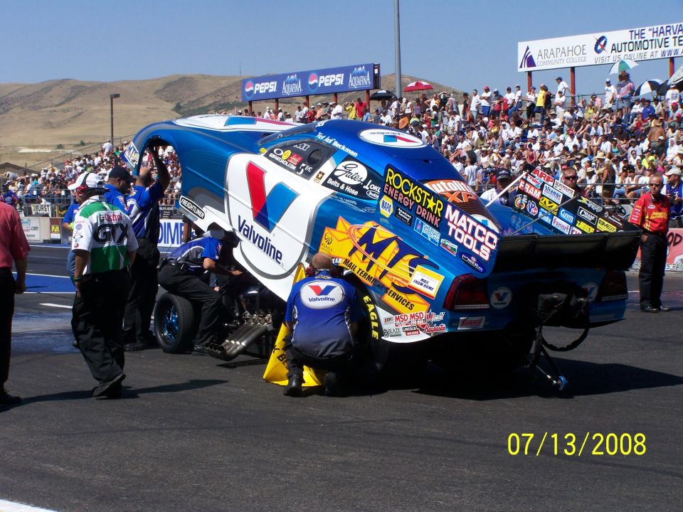 Drag racing car with crew working on it at Bandimere Speedway. Date stamp reads 07/13/2008