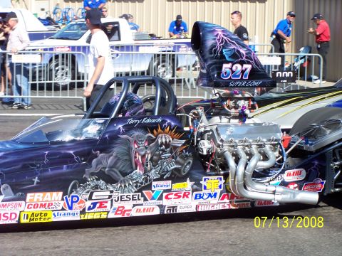 1972 Ford Ranchero - A dragster with elaborate custom graphics and sponsor decals is shown at a track on July 13, 2008.