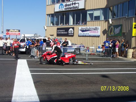 1972 Ford Ranchero - A drag racing motorcycle is on the track with a person in racing gear next to it. The date 07/13/2008 is visible.