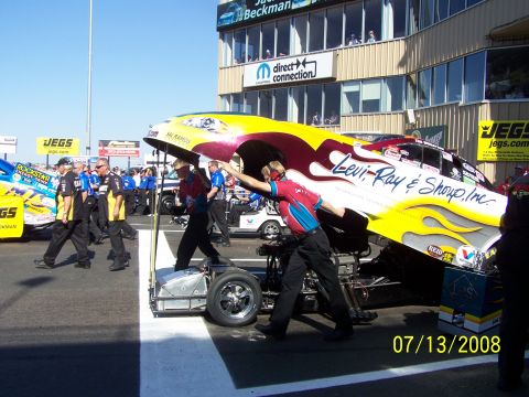1972 Ford Ranchero - Crew members work on a drag racing car body at Bandimere Speedway on July 13, 2008.