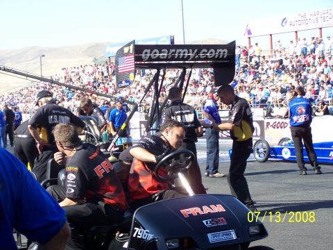 1972 Ford Ranchero - Pit crew members attend to a dragster at a race event on July 13, 2008.