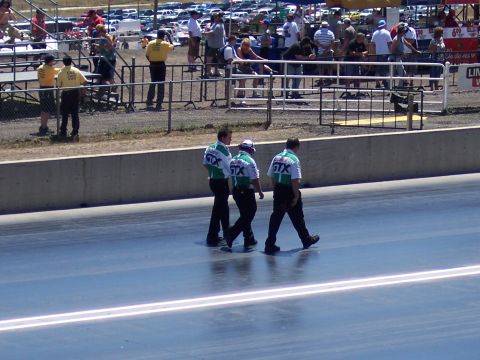 1972 Ford Ranchero - Officials walk the drag strip during an event at Bandimere Speedways.