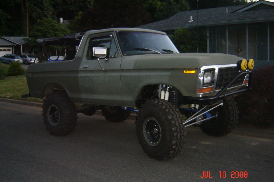 Green 1978 Ford Bronco with lifted suspension and off-road tires