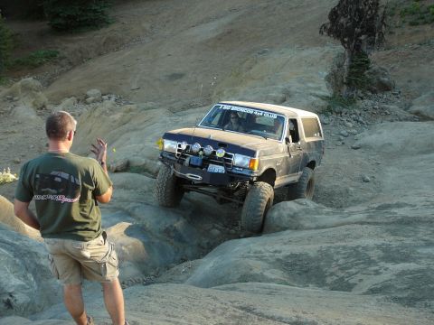 1991 Ford Bronco - A 1991 Ford Bronco tackles a challenging off-road course, demonstrating its capabilities.
