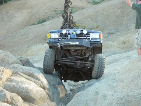 1991 Ford Bronco - This 1991 Ford Bronco is navigating a challenging rocky terrain, its off-road capabilities.