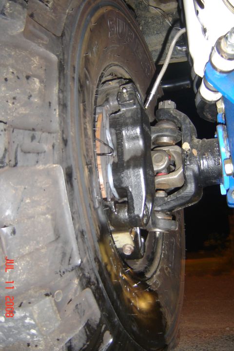 1978 Ford Bronco - The photo shows the front axle, brake caliper, and suspension of a heavy-duty off-road vehicle, not a 1978 Bronco.