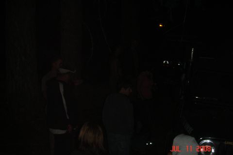 1978 Ford Bronco - A group of people are gathered around a vehicle in the dark, with a date stamp visible on the image.