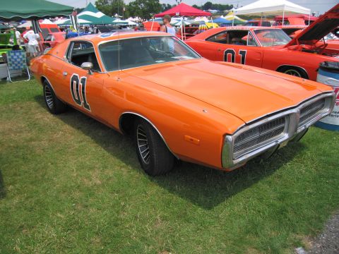 2001 Ford Crown Victoria - Orange 1971 Dodge Charger, often called the "General Lee", displayed at an outdoor car show.
