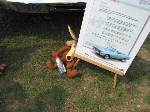 2001 Ford Crown Victoria - Photograph of a printed registry certificate letter on an easel at a car show, not a classifiable technical document.