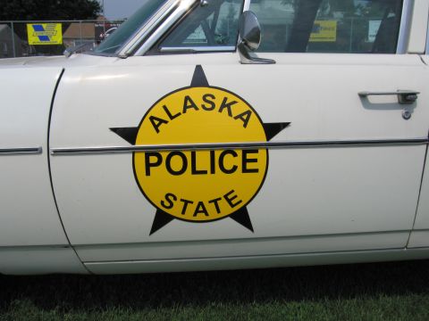 2001 Ford Crown Victoria - Alaska State Police emblem on the side of a white vehicle.