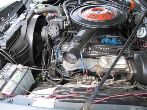 2001 Ford Crown Victoria - Close-up view of a vehicle's engine bay, showing various components and wiring.