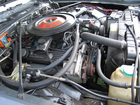 2001 Ford Crown Victoria - Close-up view of a vehicle's engine bay, highlighting various components and wiring.