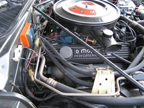 2001 Ford Crown Victoria - Close-up of an engine bay Mopar Performance valve covers and a prominent air cleaner assembly.