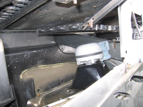 2001 Ford Crown Victoria - The horn assembly is visible behind the grille, mounted to the car's frame.