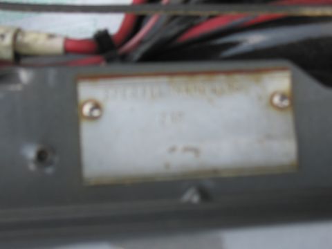 2001 Ford Crown Victoria - A close-up view of a metal identification plate, with electrical wires visible in the background.