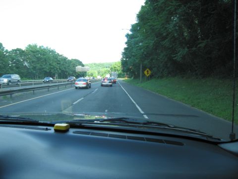 2001 Ford Crown Victoria - Photograph taken through a windshield showing traffic ahead on a divided highway.