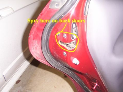 1998 Ford Taurus - Detail of a car door latch mechanism, with instructions for spraying.