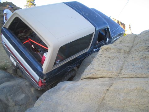 1989 Ford Bronco - This 1989 Ford Bronco is shown off-roading over large rocks.