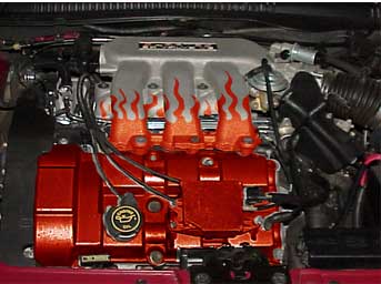 1998 Ford Taurus - Close-up view of a modified engine compartment with custom paint and decals.