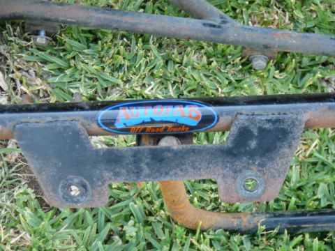 1988 Ford Bronco - Close-up of a metal frame part the Autofab Off Road Trucks logo.