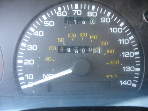 1990 Ford Taurus - The speedometer gauge displays the vehicle's speed and mileage, but offers no year identification.