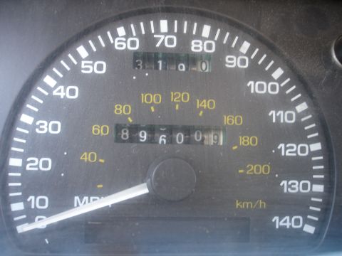 1990 Ford Taurus - The odometer reads 89,600 miles on this vehicle's speedometer.